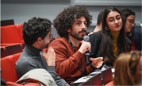 Man asking a question during a scientific conference