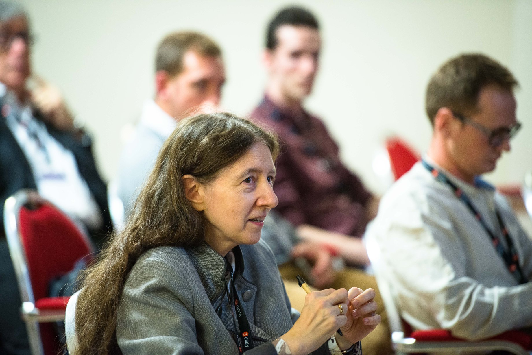 Lady listening during a conference talk