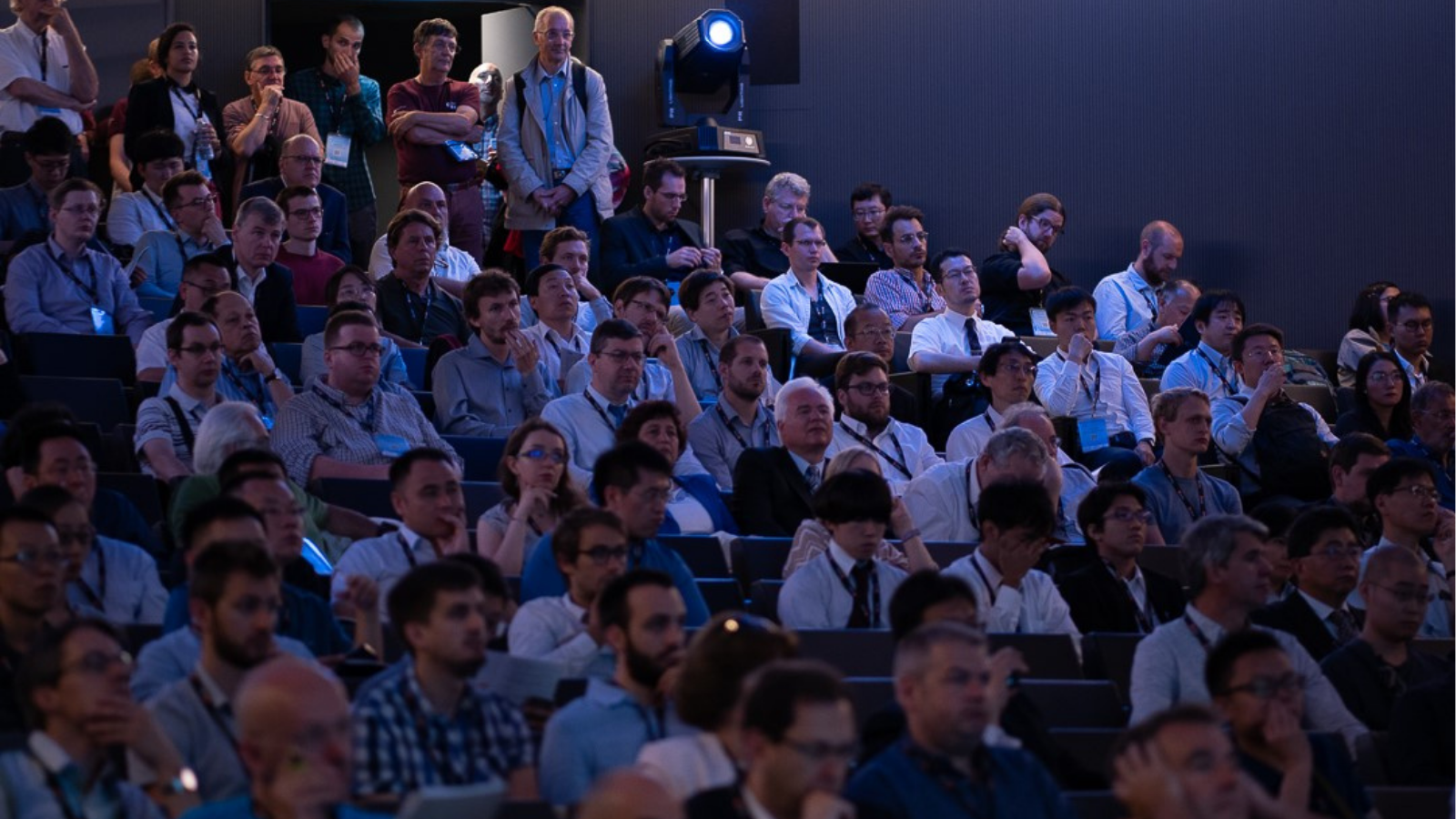 People in an auditorium at a scientific conference